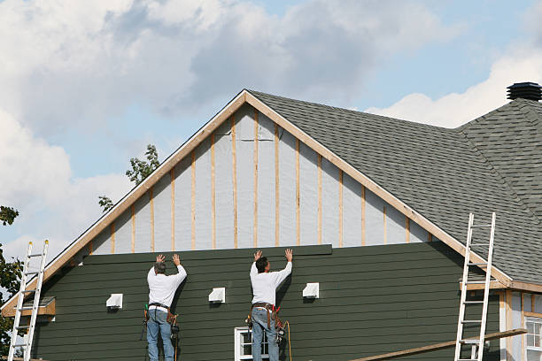 Professional Siding Replacement technician working in Sandston, VA